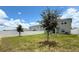 A spacious backyard with a well-manicured lawn and privacy fence at 1138 Calico Pointe Cir, Groveland, FL 34736