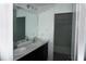 Bathroom featuring a double sink vanity and a mirror at 1138 Calico Pointe Cir, Groveland, FL 34736