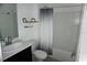 Bathroom featuring a modern vanity, toilet, and tub with a shower curtain at 1138 Calico Pointe Cir, Groveland, FL 34736