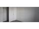 Bedroom with carpet flooring, a white door, and closet access at 1138 Calico Pointe Cir, Groveland, FL 34736