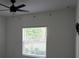 Bedroom featuring a bright window and a ceiling fan at 1138 Calico Pointe Cir, Groveland, FL 34736