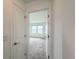 View into bedroom featuring neutral carpet and abundant natural light, creating a welcoming atmosphere at 1138 Calico Pointe Cir, Groveland, FL 34736