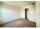 This bedroom features neutral carpet, a closet, and white walls, offering a blank slate for personalization at 1138 Calico Pointe Cir, Groveland, FL 34736