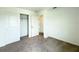 Bedroom features a closet and neutral carpet, providing a comfortable and versatile space at 1138 Calico Pointe Cir, Groveland, FL 34736
