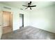 Bedroom featuring neutral carpet, a ceiling fan, and closet at 1138 Calico Pointe Cir, Groveland, FL 34736