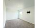 Empty carpeted bedroom with a wall mounted TV bracket, offering a blank canvas at 1138 Calico Pointe Cir, Groveland, FL 34736