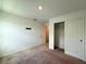 Bedroom featuring neutral carpet, white walls, closet, and plenty of space for furniture at 1138 Calico Pointe Cir, Groveland, FL 34736
