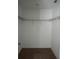 Spacious walk-in closet with built in storage ready for organization at 1138 Calico Pointe Cir, Groveland, FL 34736