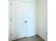 A white interior door with brushed nickel hardware and neutral flooring at 1138 Calico Pointe Cir, Groveland, FL 34736