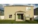 A view of the rear exterior of the home, and patio area, featuring a vinyl privacy fence at 1138 Calico Pointe Cir, Groveland, FL 34736