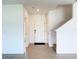 Bright Foyer featuring tile floors, coat closet and staircase leading to the upper level at 1138 Calico Pointe Cir, Groveland, FL 34736