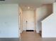 Bright Foyer featuring tile floors, coat closet and staircase leading to the upper level at 1138 Calico Pointe Cir, Groveland, FL 34736