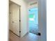 Hallway leading to bedroom with carpet flooring and a window offering natural light at 1138 Calico Pointe Cir, Groveland, FL 34736