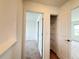 Hallway with access to a bedroom and a storage closet with shelving at 1138 Calico Pointe Cir, Groveland, FL 34736