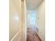 Hallway with carpet, white walls, recessed lighting, and doors leading to other rooms at 1138 Calico Pointe Cir, Groveland, FL 34736