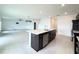 Kitchen with a large island with sink and seating at 1138 Calico Pointe Cir, Groveland, FL 34736