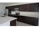 Modern kitchen featuring stainless steel appliances, granite counter tops, and ample cabinet space at 1138 Calico Pointe Cir, Groveland, FL 34736