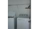 A practical laundry room comes equipped with modern, white, front-loading washer and dryer units at 1138 Calico Pointe Cir, Groveland, FL 34736