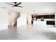 Open concept living space leads into modern kitchen with stainless steel appliances, large island, and lots of light at 1138 Calico Pointe Cir, Groveland, FL 34736