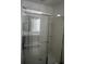 Glass-enclosed shower showcasing modern fixtures and a spa-like design at 1138 Calico Pointe Cir, Groveland, FL 34736