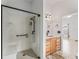 Bathroom featuring wood cabinets, white countertops, and a glass shower at 1142 W Boone Ct, Lady Lake, FL 32159
