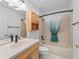 Bathroom featuring a single vanity, toilet, and bathtub shower at 1142 W Boone Ct, Lady Lake, FL 32159