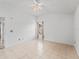 Neutral toned bedroom with tile floors and bright natural light at 1142 W Boone Ct, Lady Lake, FL 32159
