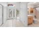 Bright Foyer featuring tile flooring and glass paneled front door at 1142 W Boone Ct, Lady Lake, FL 32159