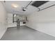 Garage featuring laundry room, utility area, and ample space at 1142 W Boone Ct, Lady Lake, FL 32159