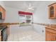 Kitchen with light wood cabinetry, granite counters, and a bright eat-in space at 1142 W Boone Ct, Lady Lake, FL 32159