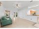 Spacious living room features tile floors, vaulted ceilings, and a ceiling fan at 1142 W Boone Ct, Lady Lake, FL 32159