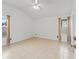 The main bedroom offers tile floors and neutral color palette at 1142 W Boone Ct, Lady Lake, FL 32159