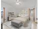 Stylishly furnished main bedroom with vaulted ceilings and neutral decor at 1142 W Boone Ct, Lady Lake, FL 32159