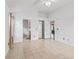 Bright main bedroom featuring tile flooring, ensuite bathroom, and closet at 1142 W Boone Ct, Lady Lake, FL 32159