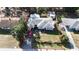 Home exterior showing full lot boundaries, nearby houses, and greenery at 1202 Deidrich Ct, Eustis, FL 32726