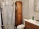 Bathroom featuring a shower, toilet and cabinet at 1202 Deidrich Ct, Eustis, FL 32726