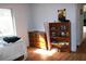 Bedroom featuring dresser, shelves and a sunny window at 1202 Deidrich Ct, Eustis, FL 32726