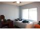 Bedroom featuring a cozy bed, desk, and lots of natural light at 1202 Deidrich Ct, Eustis, FL 32726