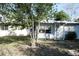 Well-kept home with a combination of siding and charming details on a lush green lawn at 1202 Deidrich Ct, Eustis, FL 32726