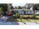 Charming single-story home featuring a well-maintained lawn and mature landscaping at 1202 Deidrich Ct, Eustis, FL 32726