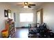 Bright living room with hardwood floors, a ceiling fan, and a sliding glass door with lots of natural light at 1202 Deidrich Ct, Eustis, FL 32726