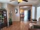 An open living room showcases wood laminate flooring and seamless flow to the kitchen at 1202 Deidrich Ct, Eustis, FL 32726