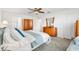 Spacious bedroom with natural light, complemented by a ceiling fan at 1309 Lester Dr, Lady Lake, FL 32159