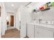 Laundry area featuring washer and dryer and practical shelving at 1309 Lester Dr, Lady Lake, FL 32159