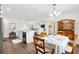 Open floor plan featuring a dining area connected to the kitchen and a living room with natural light at 1309 Lester Dr, Lady Lake, FL 32159