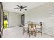 Outdoor patio area with a dining set and ceiling fan at 1309 Lester Dr, Lady Lake, FL 32159