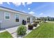 The backyard shows a patio and vinyl siding with well-maintained landscaping at 1478 Erika Pl, The Villages, FL 32163
