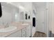 Bright bathroom featuring a double sink vanity with plenty of counter space and a well-lit mirror at 1478 Erika Pl, The Villages, FL 32163