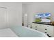 Cozy bedroom features a neatly made bed, dresser with television, and closet offering a relaxing retreat at 1478 Erika Pl, The Villages, FL 32163