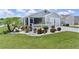 Beautiful home features an attached garage, manicured lawn, and decorative white picket fence surrounding a landscaped garden at 1478 Erika Pl, The Villages, FL 32163